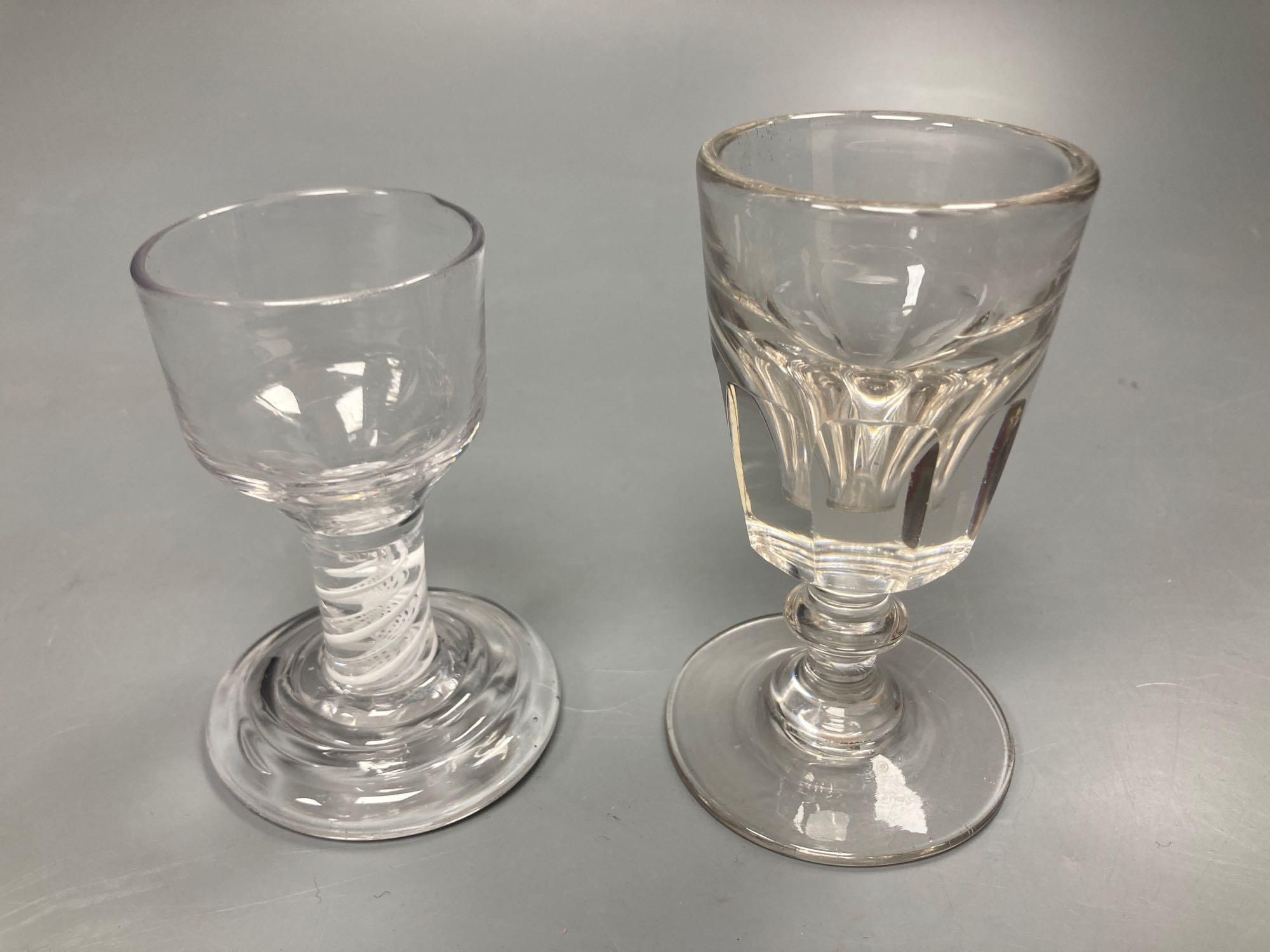 Two toasting glasses, one with air twist stem